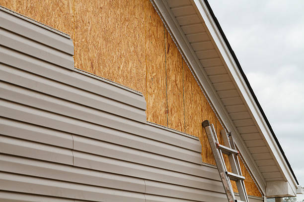 Professional Storm Damage Siding Repair technician working in Hamburg, PA
